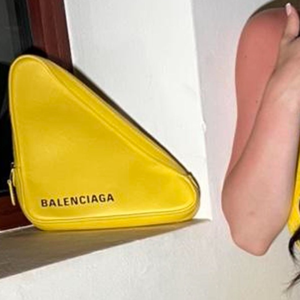 Yellow Balenciaga triangle clutch